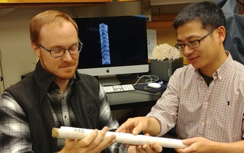Researchers examine a coral core