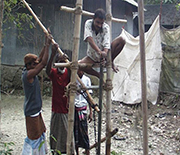 Close-up of team drilling a shallow well in Bangladesh.