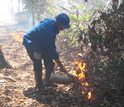 Scientist advancing  a fire line in an experimental fire plot in Mato Grosso, Brazil.