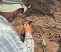 Scientists excavate the remains of <em>T. rhadinus</em> and other animals in southern Tanzania.