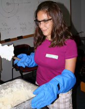 "SciGirls" camp participant Alex Wells checks out her newly finished batch of nitrogen ice