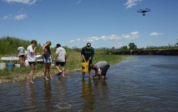 UAV-based hyperspectral imaging research at Montana State University, with students collecting samples from a stream while a UAV collects data from overhead