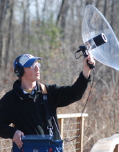Biologist Kyle Horton with equipment used to record bird songs