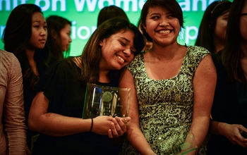 Women holding an award