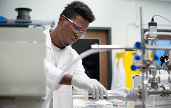 A student conducting research in a science laboratory.