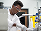 A student conducting research in a science laboratory.