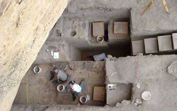 Looking down on North Creek Shelter site shows graduate students excavating an Early Archaic level