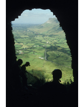 An international research team takes in the view from the mouth of a cave in Ireland