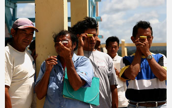 Makushi indigenous people being trained to use a compass in the Amazon basin