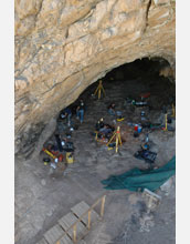 Cave in South Africa where evidence of early human use of shellfish and fire has been discovered