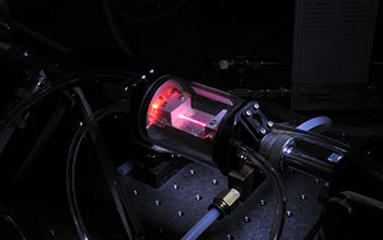 Waveguide filled with high-pressure helium gas as X-ray beam is generated