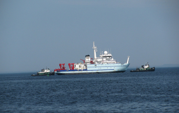 The R/V <em>Sikuliaq</em> is seen here getting a tow on the Marinette River in Wisconsin