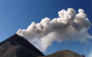 A small explosion from Fuego, an open vent volcano located 20 miles west of Guatemala City