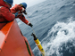 Researcher Stephen Riser drops a float into Antarctica's Southern Ocean during a 2016-17 cruise.