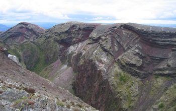 The reddish deposits are remnants of the 1886 eruption, which cut through the lava domes.