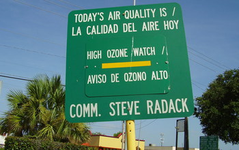Road sign showing the quality of the air is high ozone watch