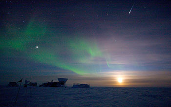 Auroras and an iridium flare appear over the Dark Sector of Amundsen-Scott South Pole Station