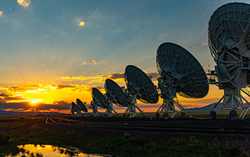 The NSF Very Large Array at dusk with the moon rising