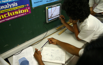 student working on a tablet in a classroom