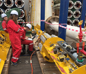 Shipboard scientists test valves and data loggers