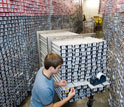 Photo of a researcher in a core repository where cores are stored.