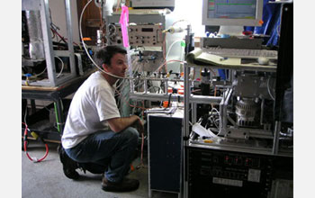 Photo of scientist Edward Dunlea calibrating an aerosol mass spectrometer at the Storm Peak Lab.