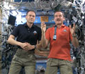 astronauts on space station with microphone