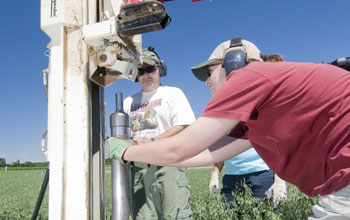 Researchers collecting soil cores to determine carbon storage at the LTER site.