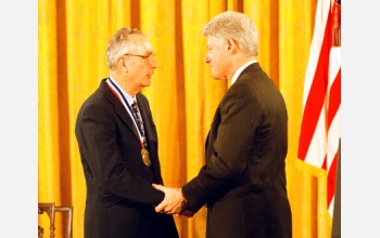 John Bahcall receives the Medal of Science from President Clinton.
