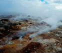 volcanic mountaneous area near Reykjavik, Iceland, with steam rising
