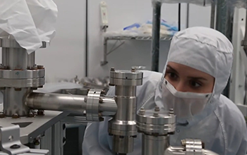 scientist inspecting lab instruments