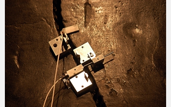 A close-up view of the MicroStrain NANO-DVRT wireless sensors clamped to the Liberty Bell.