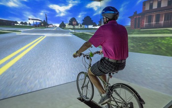 Adult on a stationary bike in a virtual envrionment