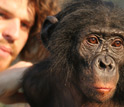 Photo of Duke University anthropologist Brian Hare with one of his bonobo subjects.