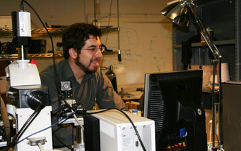 Ed Boyden with a computer and equipment in his office