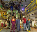 Photo of scientists and engineers beneath the rig floor.