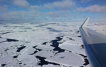 The NSF/NCAR Gulfstream V casts a shadow on the marginal ice zone of the Southern Ocean.