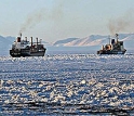 The icebreaker Krasin escorts the cargo ship American Tern out of McMurdo Sound.