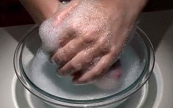 Hands in soapy water