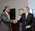 Photo of Subra Suresh and José Miguel Aguilera shaking hands.