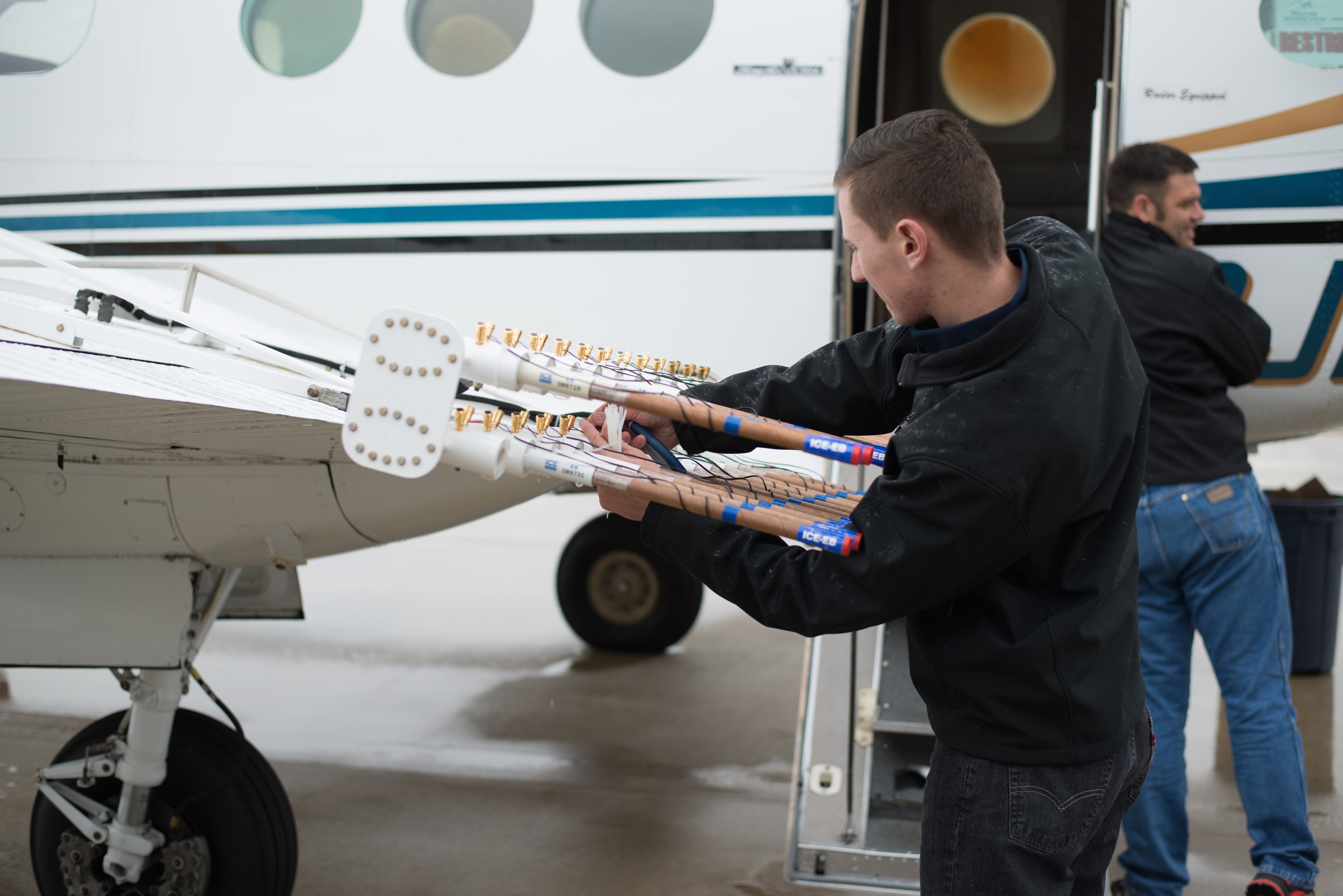 Multimedia Gallery - Pilots from Weather Modification, Inc., prepare 