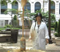 Photo of Cherlyn Anderson demonstrating the notorious Diet Coke and Mentos experiment at NSF.