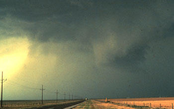 Storms clouds on a dark sky above a road