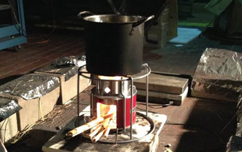 The new EZY stove using millet stalks as fuel is tested for emissions in a lab.