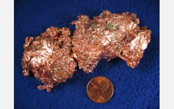 Multimedia Gallery - This image shows copper in ore. The penny is 97.5  percent zinc and 2.5 percent copper.