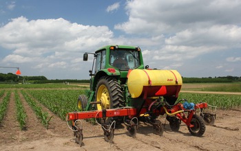 tractor  in a corn field at the NSF Kellogg Biological Station LTER site.