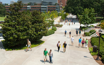 people walking on a sidewalk