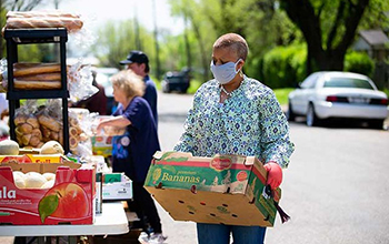 food being distributed at a drive-up food pantry