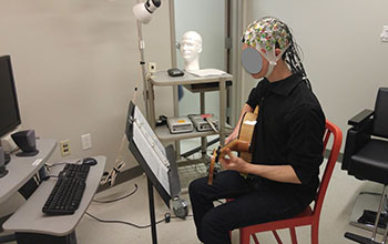 jazz guitar player improvising while brain activity is recorded
