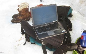 laptop, backpack and snowshoes used in the field while doing research